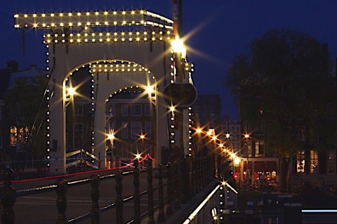 Magere Brug Amsterdam lit up at night time